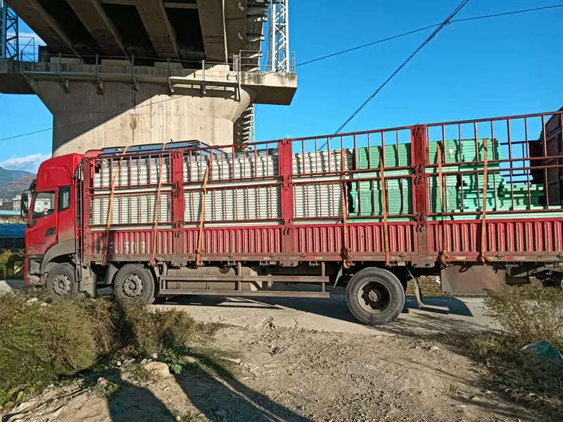 Arrival and unloading of cold‑storage insulation panels at Liangshan blueberry base site
