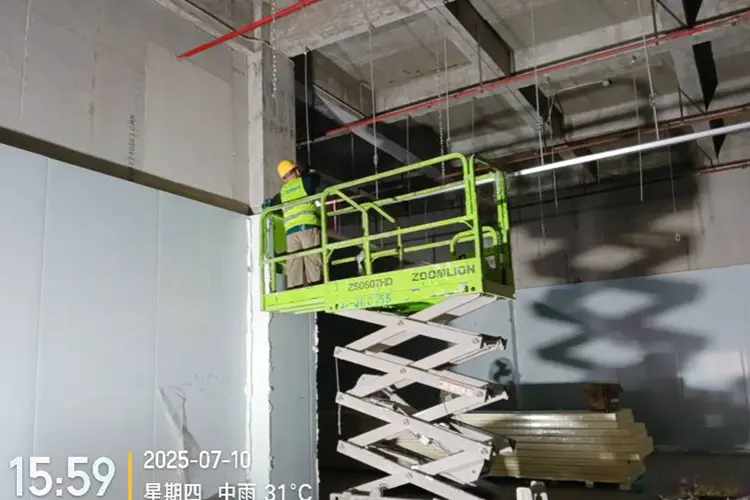 Workers installing cold storage panels
