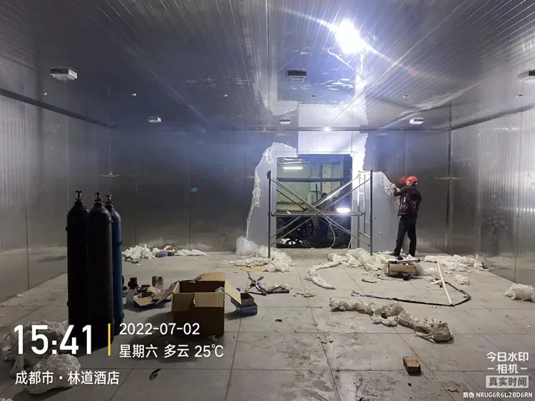 Workers tearing off protective film