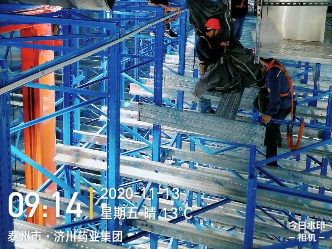 Workers install shelves