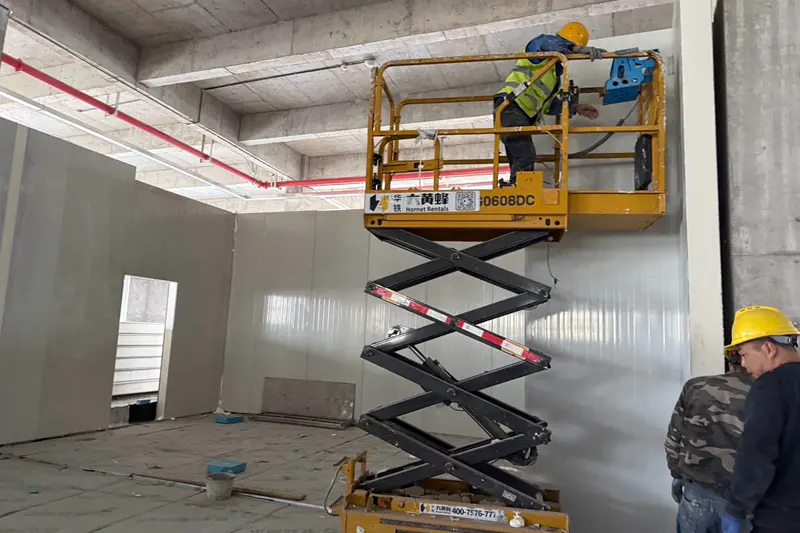 Haocool workers installing wall panels for a meat cold storage facility